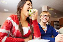 Student eating apple